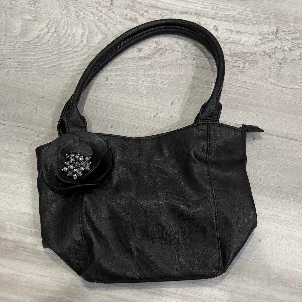 Elegant Black Handbag with Floral Accent